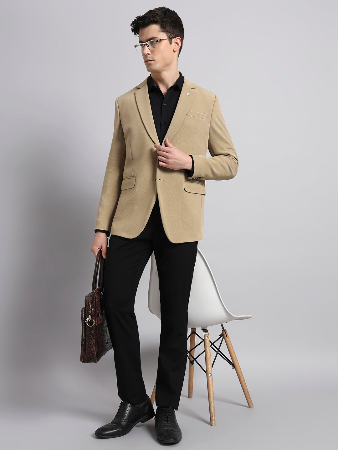 Signature style beige blazer in studio fashion shoot