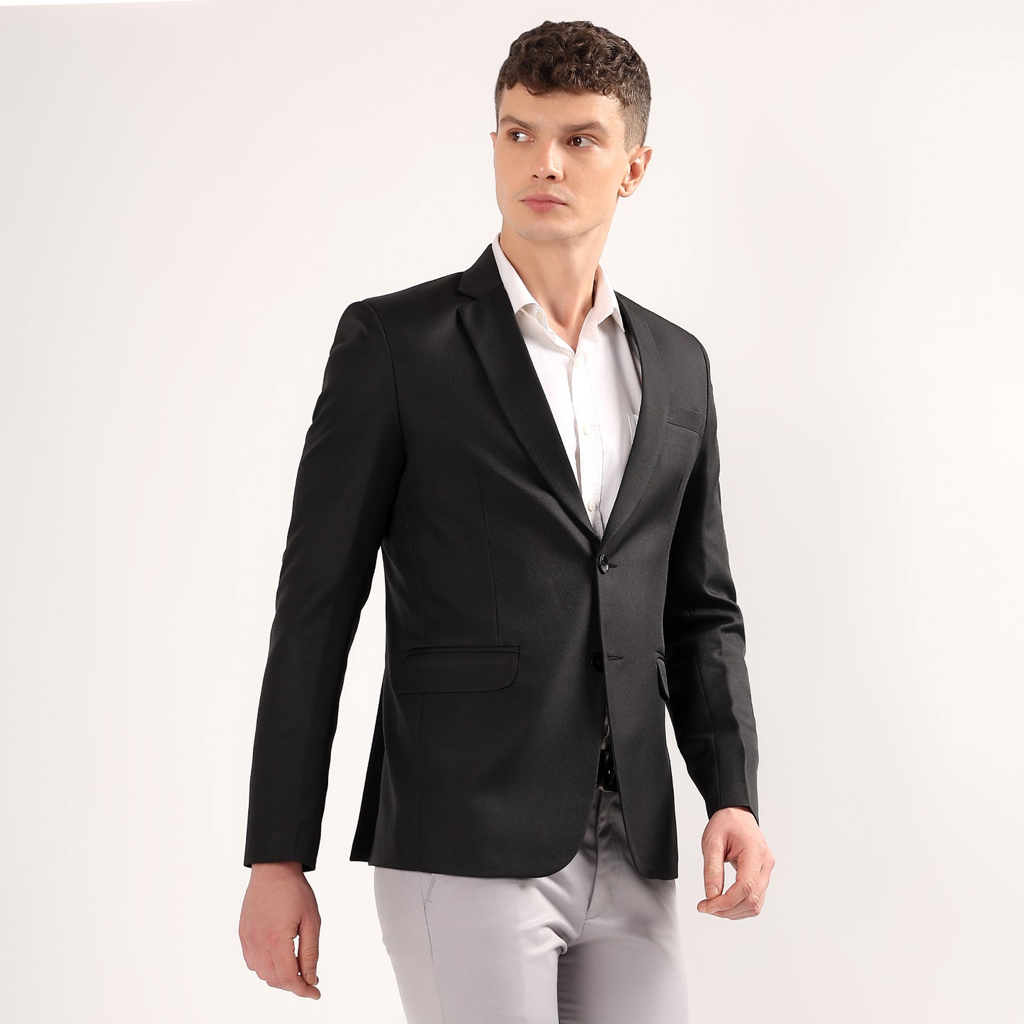 Close up of Darelooks black blazer showcasing practical 5 pocket layout with clean stitch lines