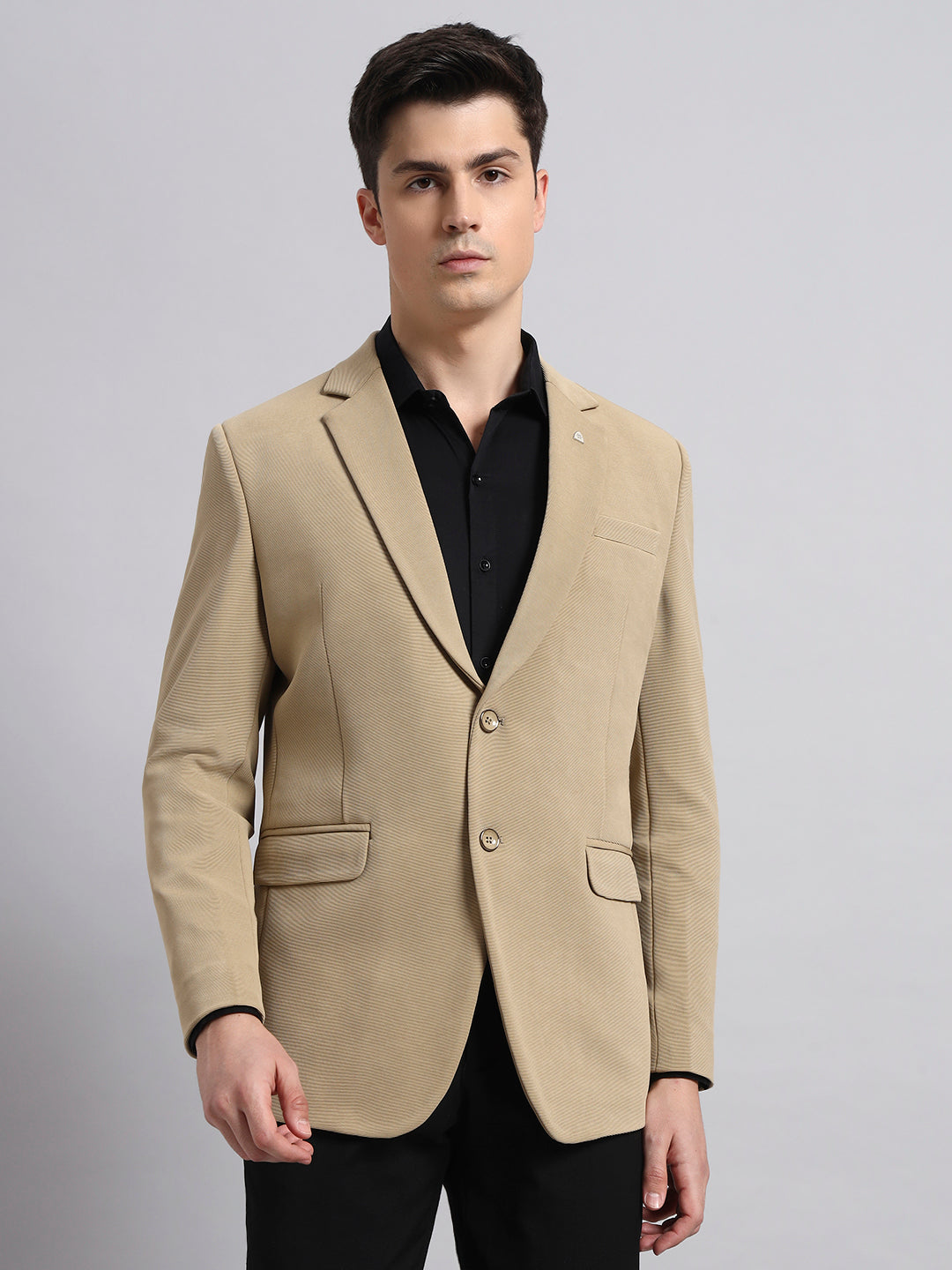 Precision tailoring and premium finish of beige stretch blazer