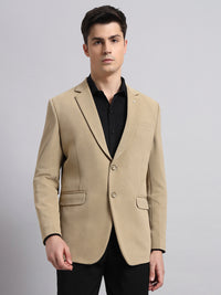 Precision tailoring and premium finish of beige stretch blazer