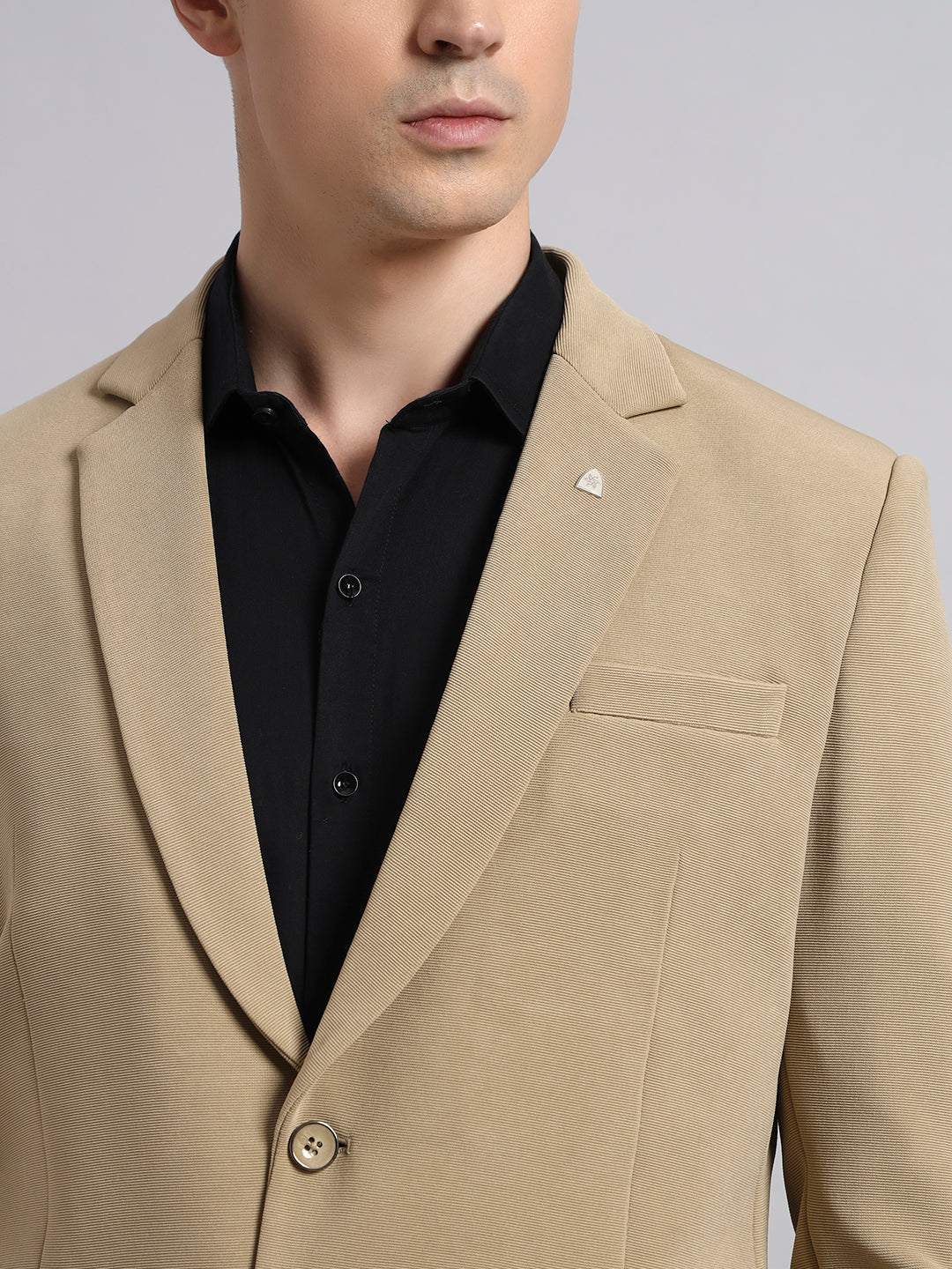 Detailed view of stretchable beige blazer fabric texture