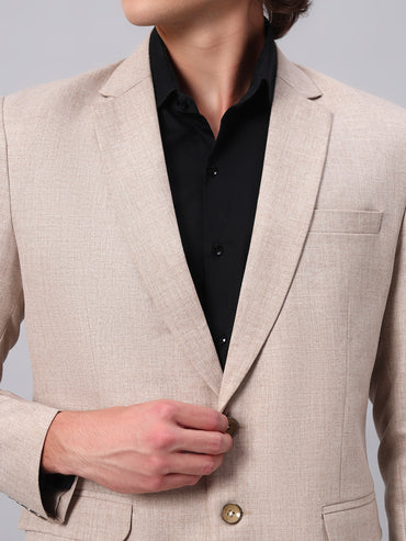 Close view of smooth viscose fabric in beige blazer