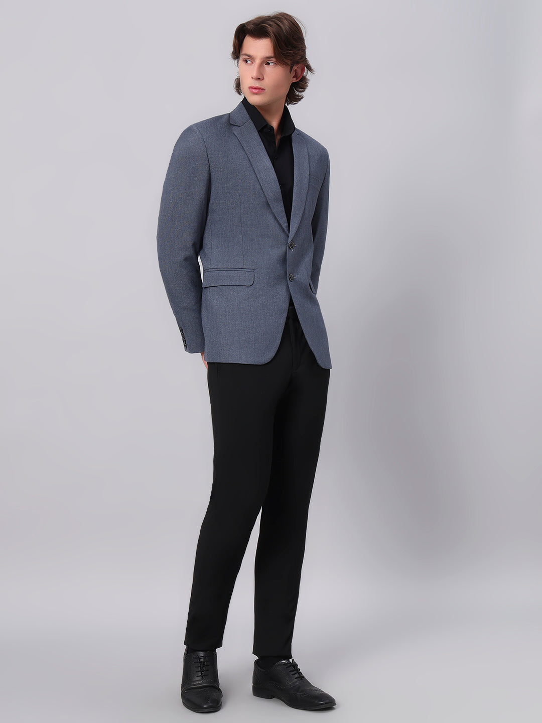 Refined tailoring and premium finish of blue blazer
