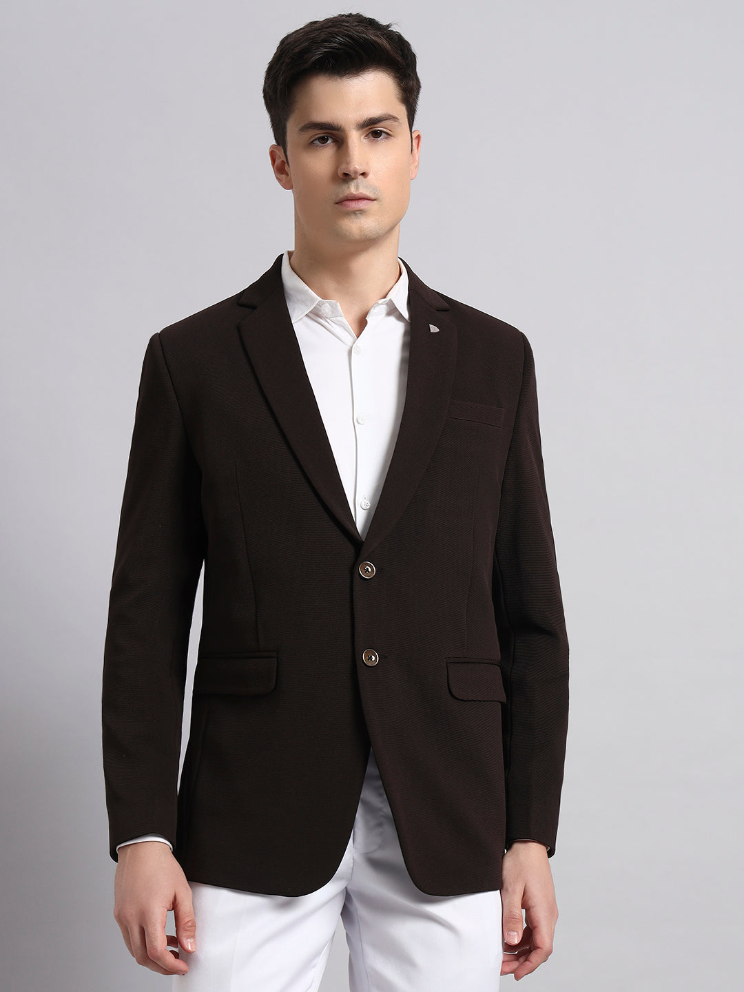 Premium craftsmanship and stitching on brown men’s blazer