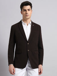 Premium craftsmanship and stitching on brown men’s blazer