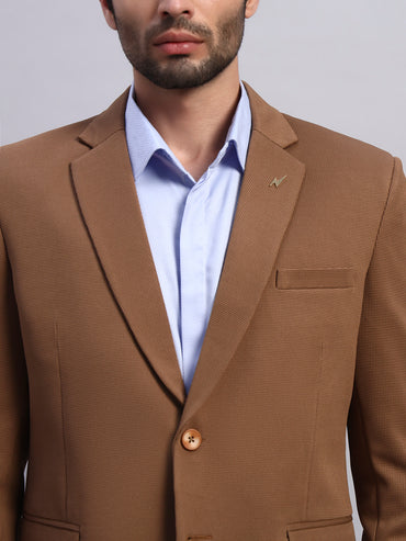 Close view of high performance stretch blazer fabric in brown