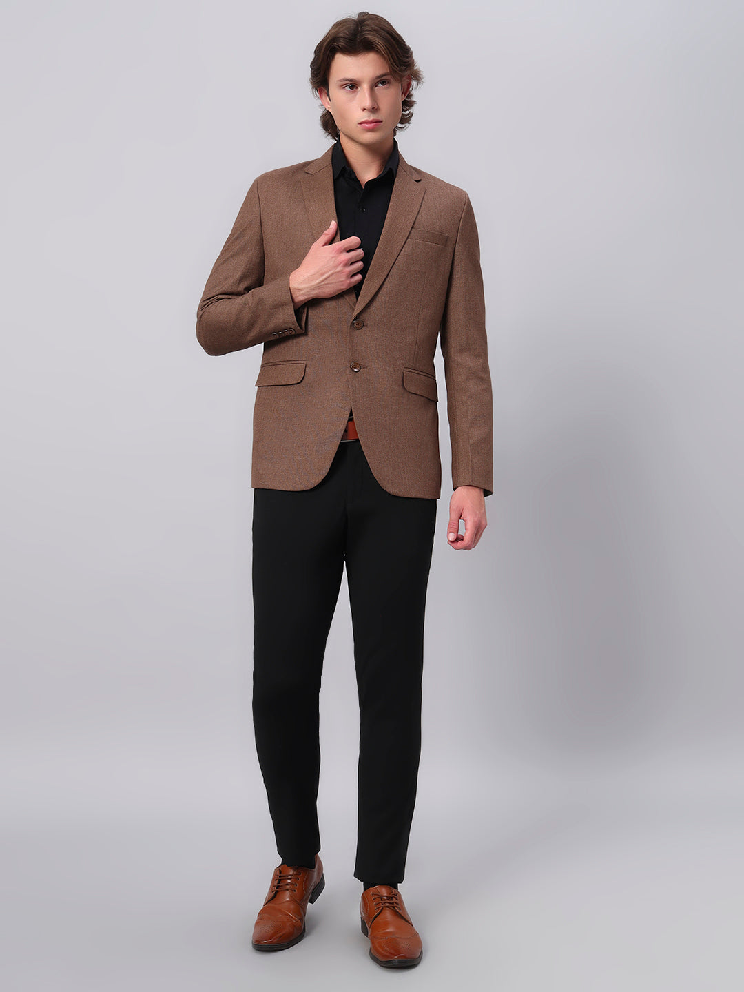 Refined tailoring and premium finish of brown blazer