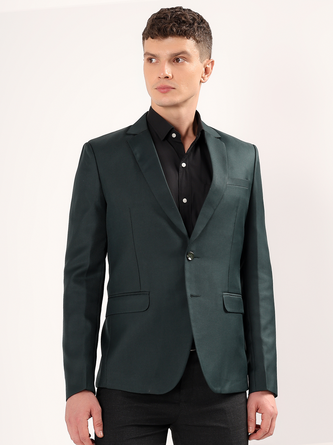 Men wearing green blazer styled for bold formal look