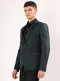 Refined tailoring and premium finish of green blazer