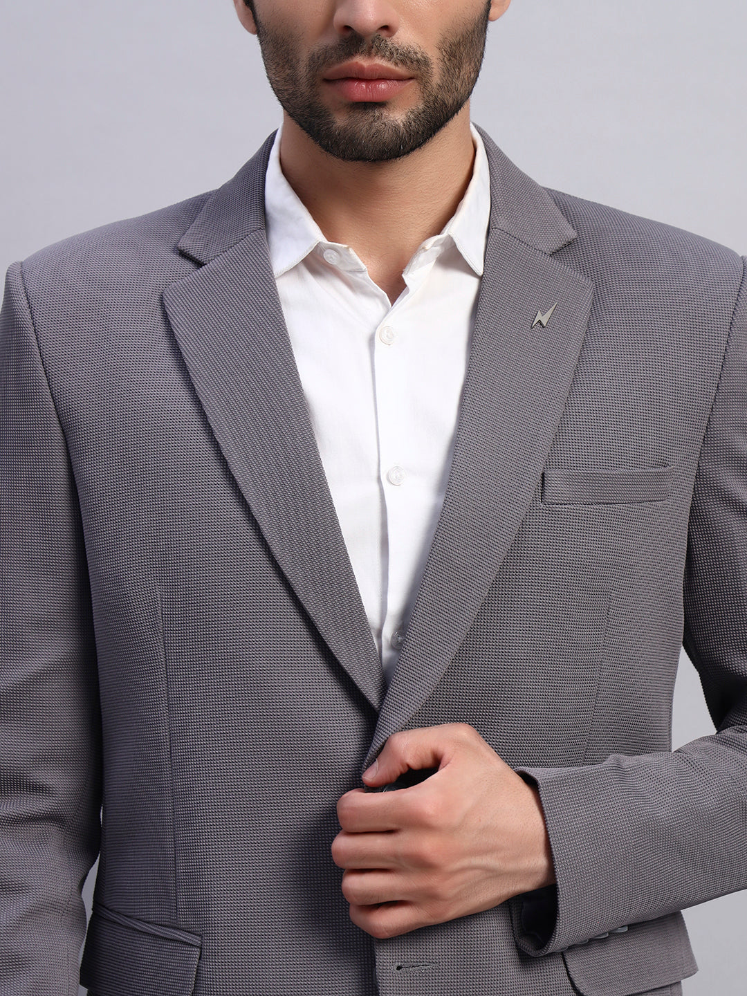 Close up of advanced stretch fabric in grey blazer