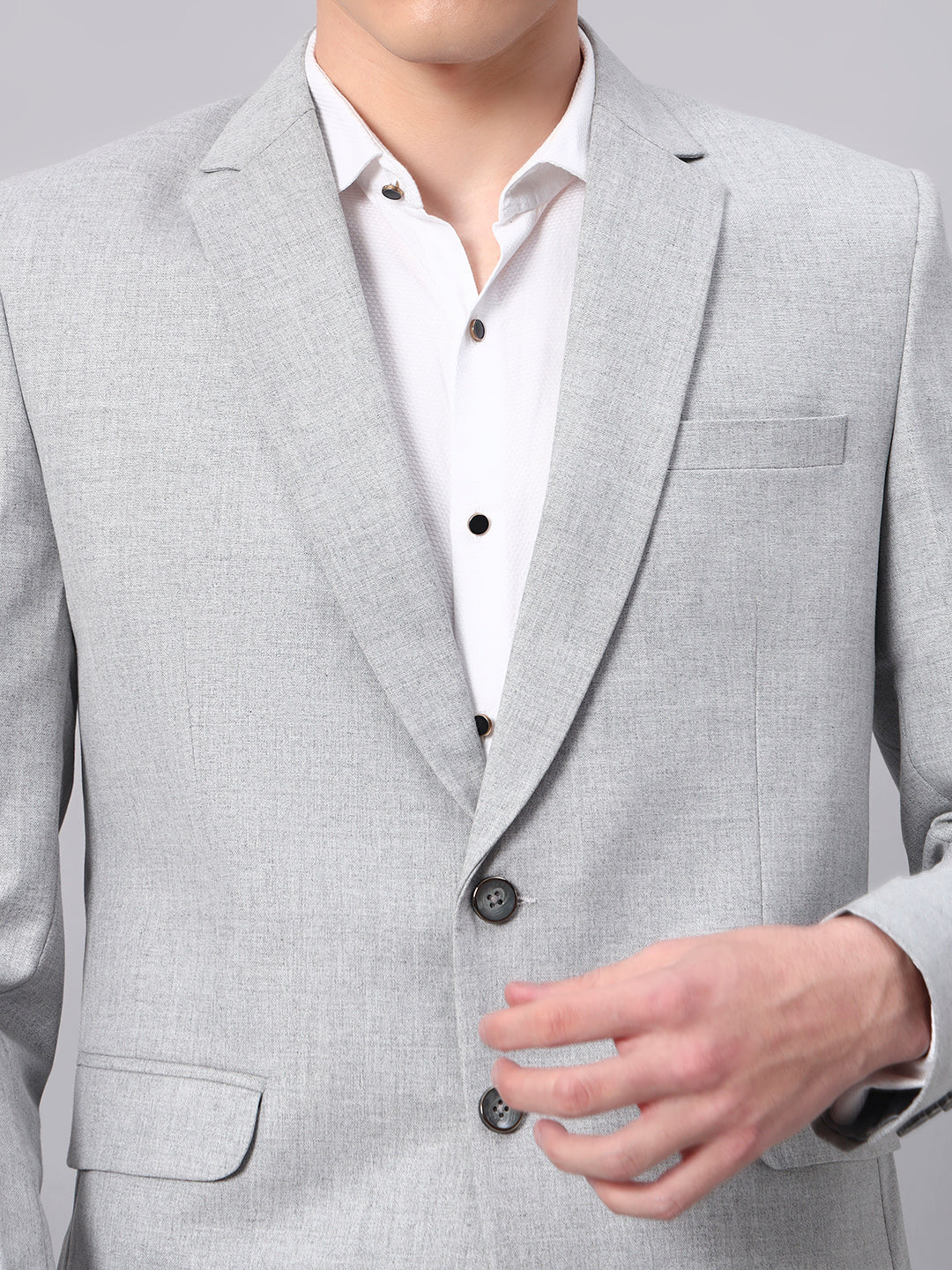 Close view of smooth viscose fabric in light grey blazer