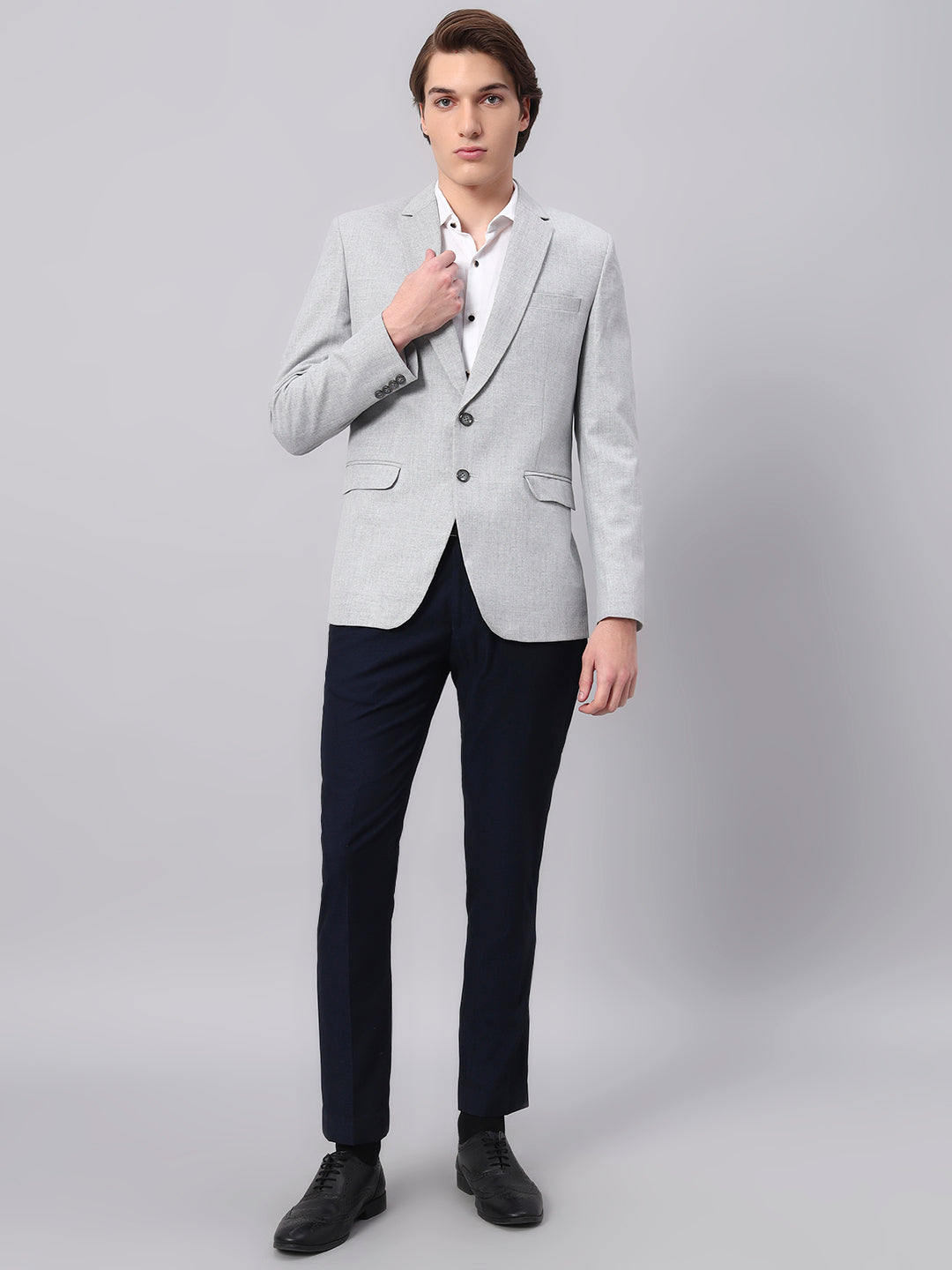 Refined tailoring and premium finish of light grey blazer