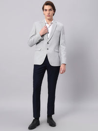 Refined tailoring and premium finish of light grey blazer