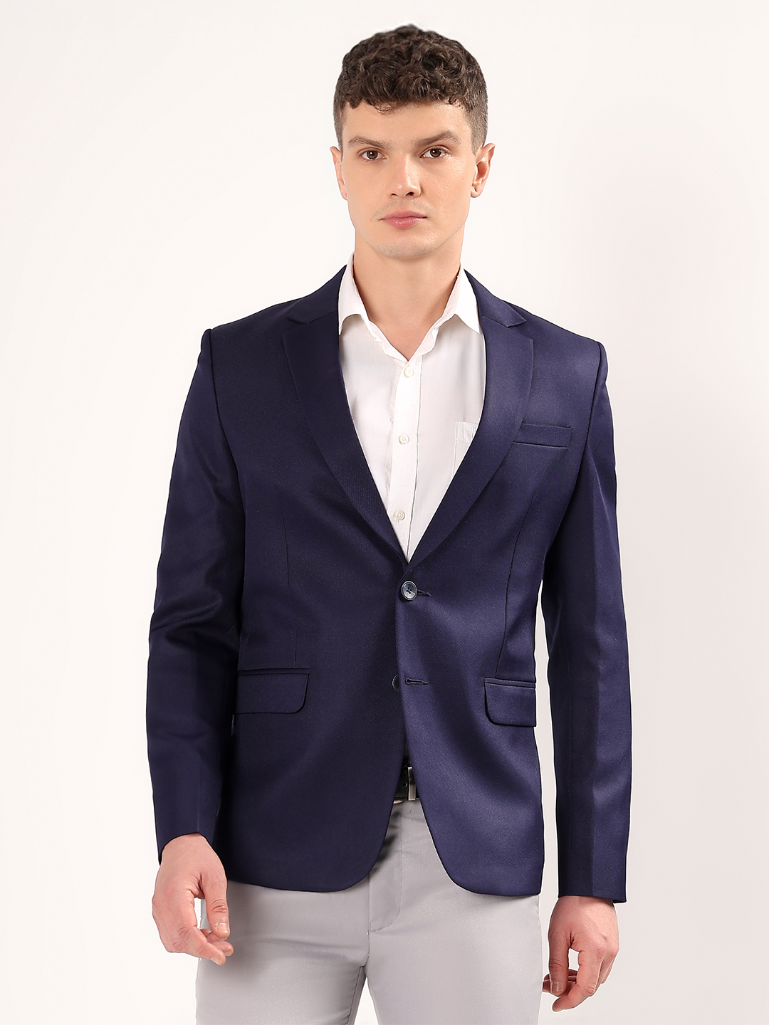 Men wearing navy blue blazer styled for classic formal look