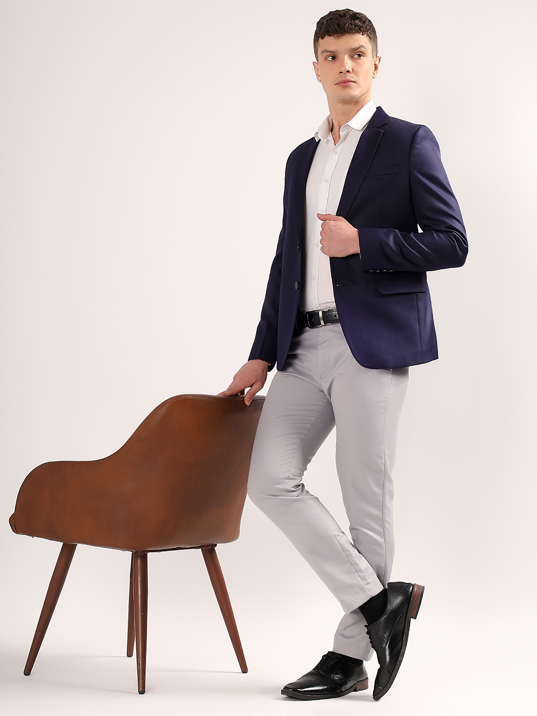 Professional formal styling with navy blue blazer