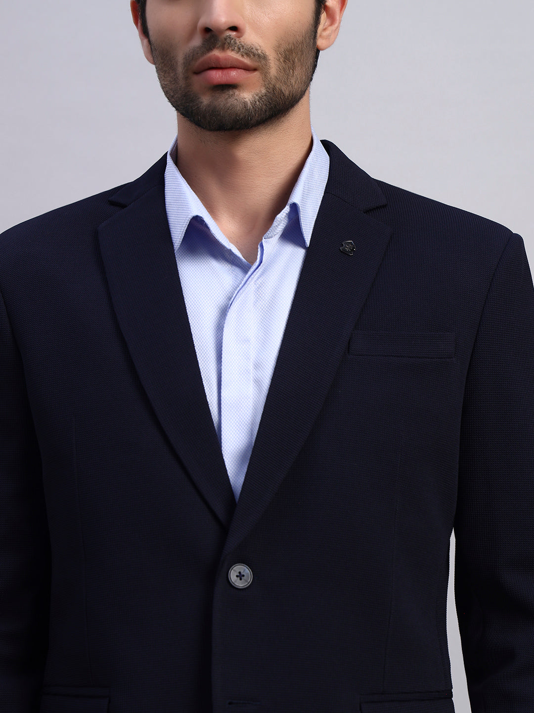 Close view of stretch fabric in navy blue blazer