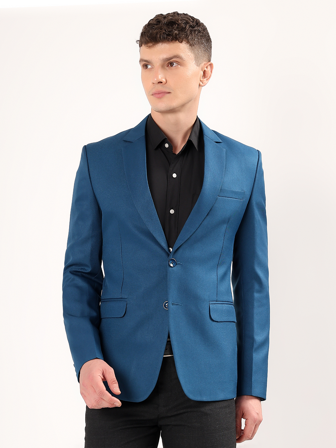 Men wearing peacock green blazer styled for bold formal look