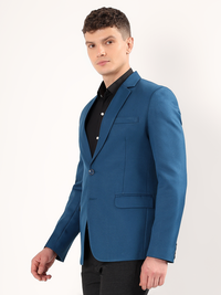 Refined tailoring and premium finish of peacock green blazer