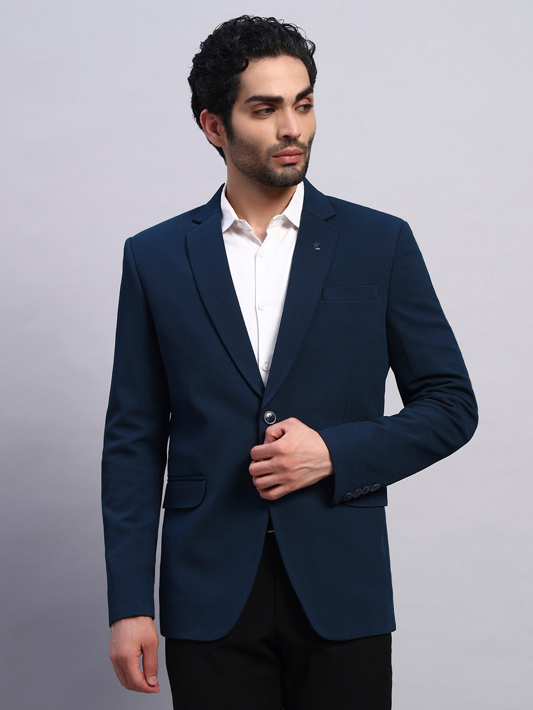 Modern edge outfit featuring peacock green stretch blazer