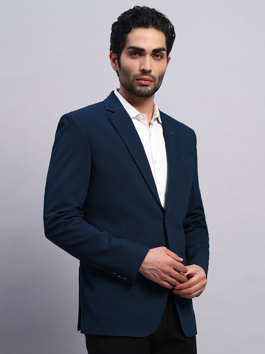 Rich peacock green stretchable blazer styled for bold fashion look