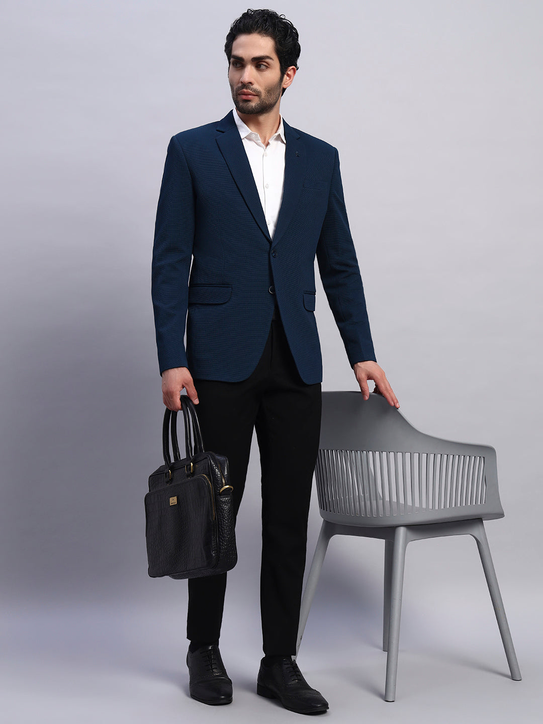 Statement styling with peacock green stretch blazer