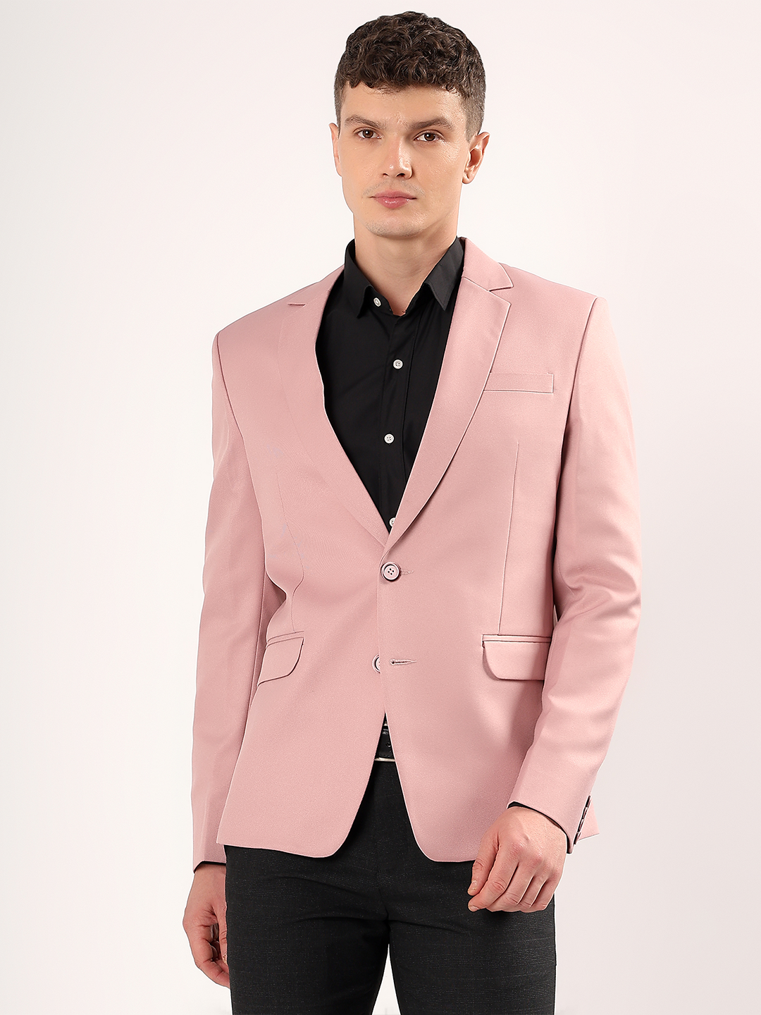 Men wearing pink blazer styled for modern formal look