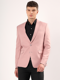 Men wearing pink blazer styled for modern formal look