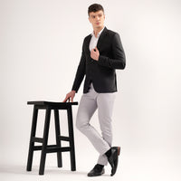 Side view of Darelooks black blazer structured silhouette with movement enhancing double vents
