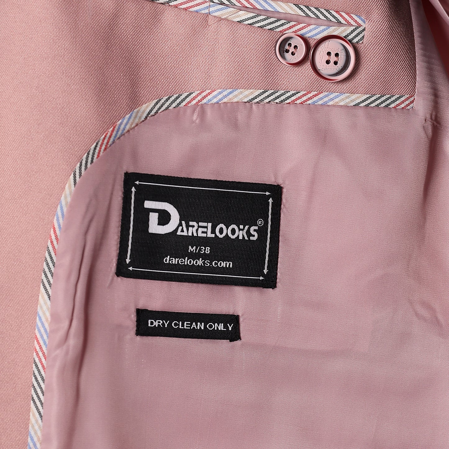Notch lapel close up of Darelooks men's pastel pink blazer  clean structure and premium finish